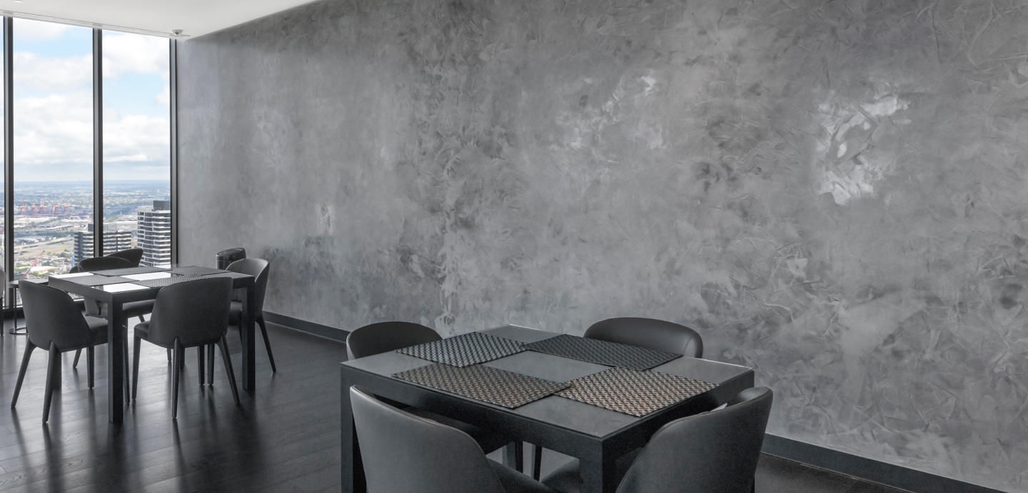 grey polished plaster in the sky lounge at abode apartments melbourne